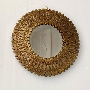vintage round starburst stamped metal mirror with scalloped edge